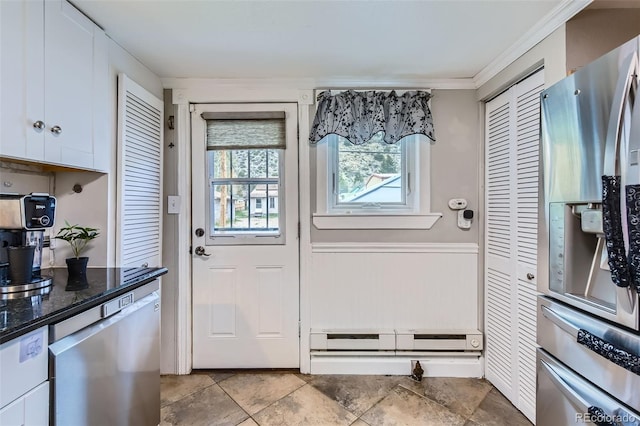 doorway with ornamental molding and a baseboard radiator