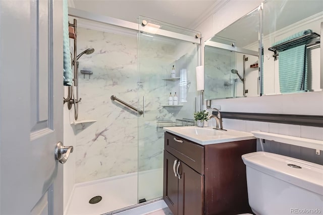 bathroom featuring a marble finish shower, vanity, toilet, and ornamental molding