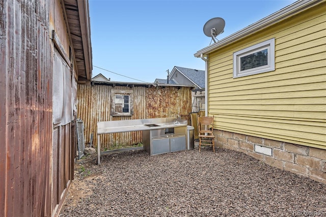 view of home's exterior featuring fence