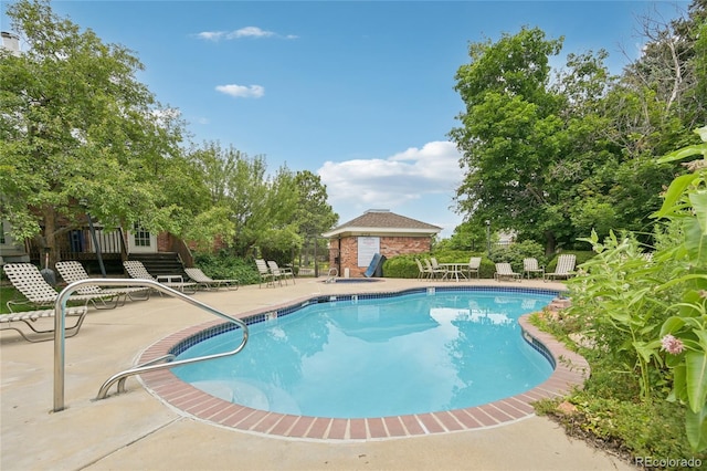 13873 E Lehigh Ave Unit C, Aurora, CO 80014 - community pool featuring a patio area