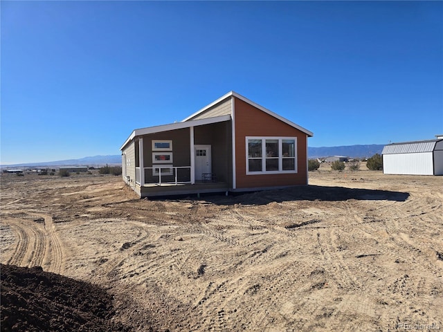 view of front of property with a mountain view