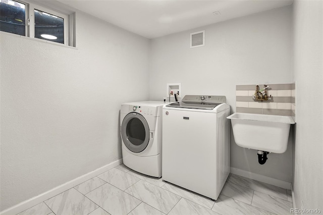 laundry room with washer and dryer