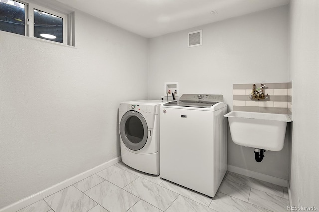 laundry room featuring visible vents, laundry area, marble finish floor, baseboards, and independent washer and dryer