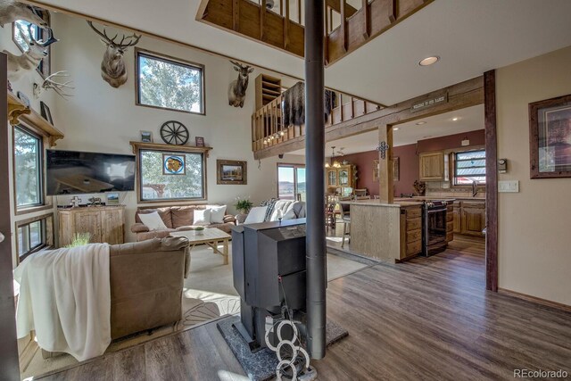 311 Longs Rd, Silverthorne, CO 80498 - living room with wood finished floors, healthy amount of natural light, a high ceiling, and recessed lighting