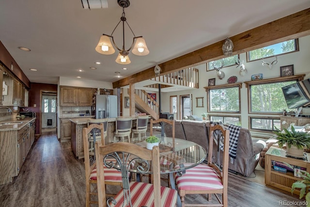 311 Longs Rd, Silverthorne, CO 80498 - dining room featuring plenty of natural light, dark wood-style floors, a chandelier, and recessed lighting