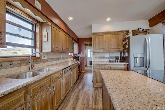 311 Longs Rd, Silverthorne, CO 80498 - kitchen with a sink, stainless steel fridge, light wood finished floors, backsplash, and recessed lighting