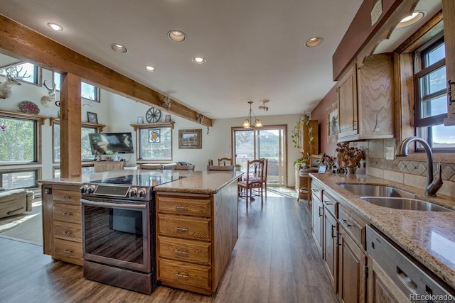 311 Longs Rd, Silverthorne, CO 80498 - kitchen featuring appliances with stainless steel finishes, a sink, recessed lighting, wood finished floors, and beamed ceiling