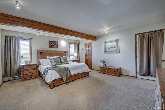 311 Longs Rd, Silverthorne, CO 80498 - bedroom featuring multiple windows, carpet floors, beamed ceiling, and baseboards