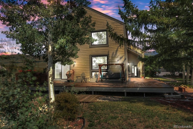 311 Longs Rd, Silverthorne, CO 80498 - back of house featuring a wooden deck and a lawn