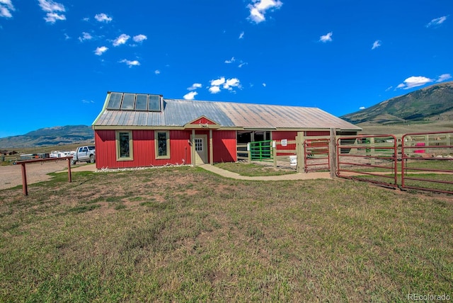 311 Longs Rd, Silverthorne, CO 80498 - view of front of home featuring a mountain view, metal roof, an outbuilding, and an exterior structure