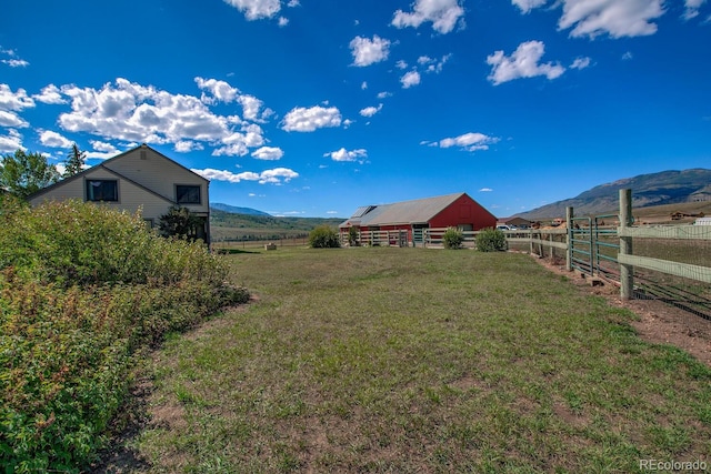 311 Longs Rd, Silverthorne, CO 80498 - view of yard featuring an outbuilding, a view of countryside, and a mountain view