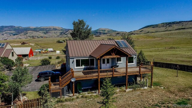311 Longs Rd, Silverthorne, CO 80498 - rear view of property with a deck with mountain view, fence, a standing seam roof, and metal roof