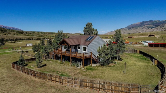 311 Longs Rd, Silverthorne, CO 80498 - rear view of house featuring a deck with mountain view, a rural view, and metal roof
