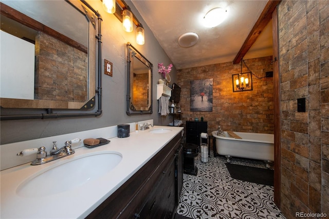 bathroom with beam ceiling, vanity, brick wall, tile patterned floors, and a bathing tub