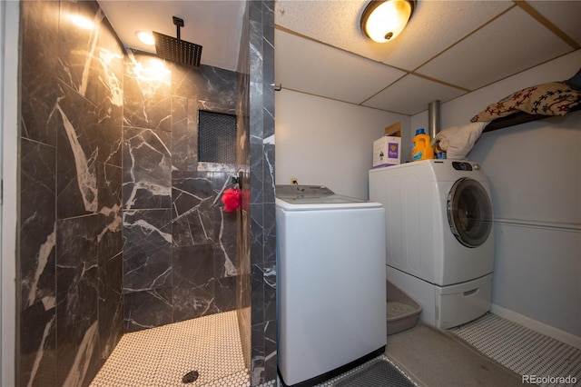 clothes washing area with washer and clothes dryer