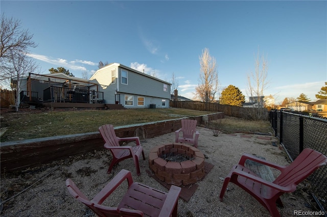 view of patio featuring a deck and a fire pit