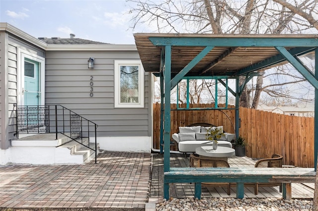 view of patio featuring fence