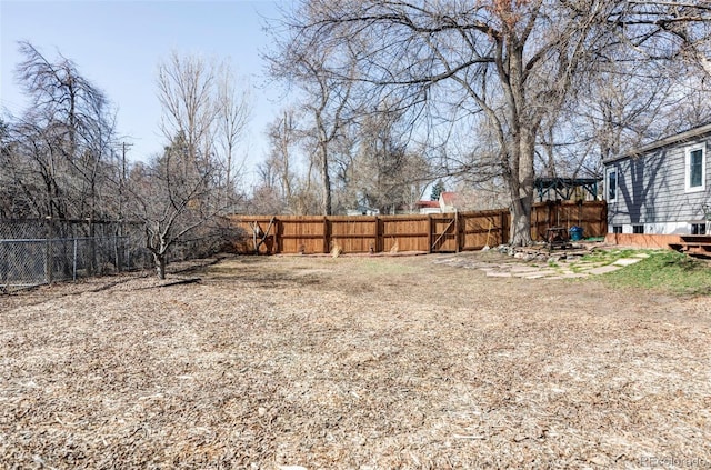 view of yard featuring a fenced backyard