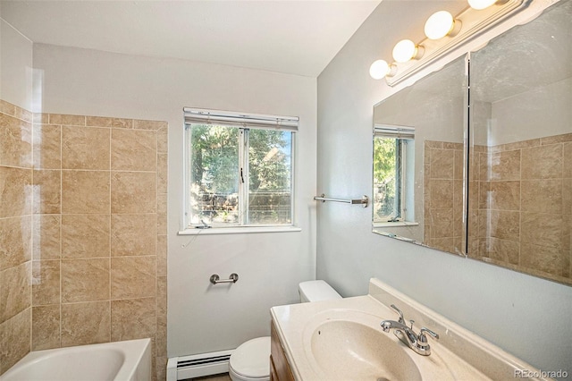 bathroom with shower / washtub combination, toilet, vanity, and a baseboard radiator