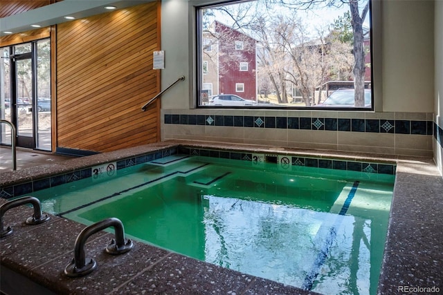 view of pool with a swimming pool and an indoor hot tub