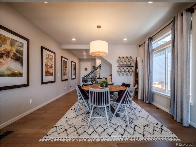 dining area with recessed lighting, visible vents, baseboards, stairs, and dark wood finished floors