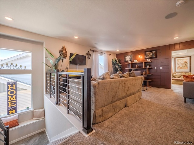 living area featuring carpet floors, recessed lighting, and baseboards