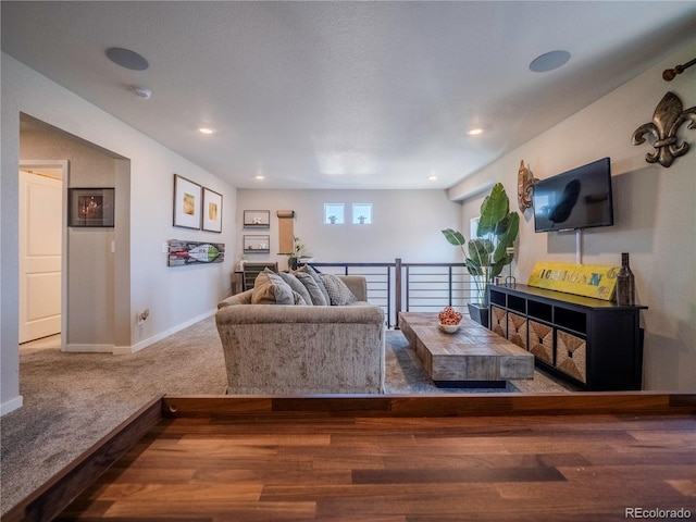 living room with carpet, baseboards, and recessed lighting