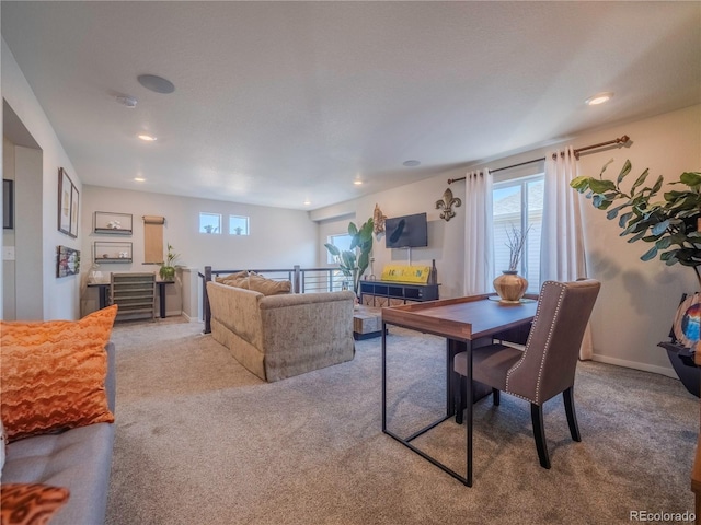 dining room featuring light carpet, recessed lighting, plenty of natural light, and baseboards