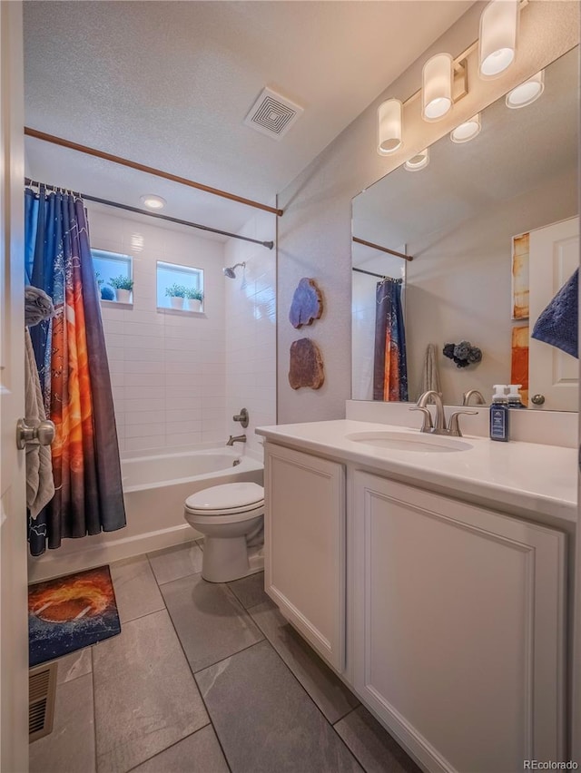 bathroom with shower / tub combo, visible vents, vanity, and toilet