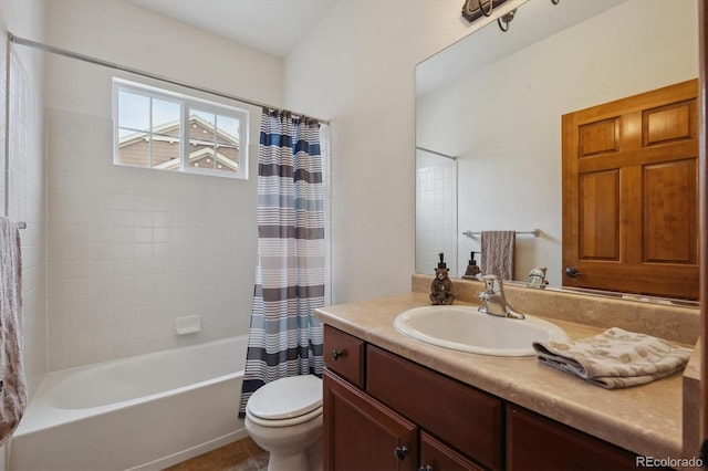 full bath featuring toilet, shower / tub combo with curtain, and vanity