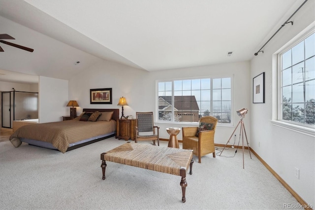 carpeted bedroom with visible vents, baseboards, and vaulted ceiling