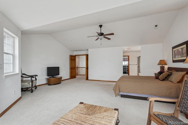 carpeted bedroom with lofted ceiling, ceiling fan, and baseboards