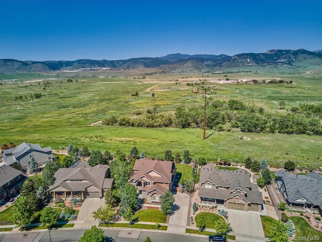 drone / aerial view featuring a residential view and a mountain view