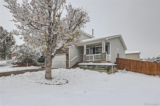 view of front of house with a porch and a garage