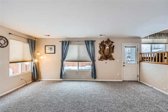 unfurnished room featuring carpet