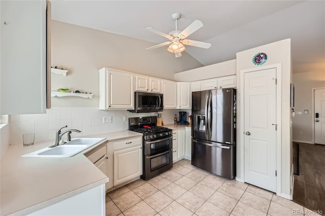 kitchen with ceiling fan, sink, white cabinets, and appliances with stainless steel finishes