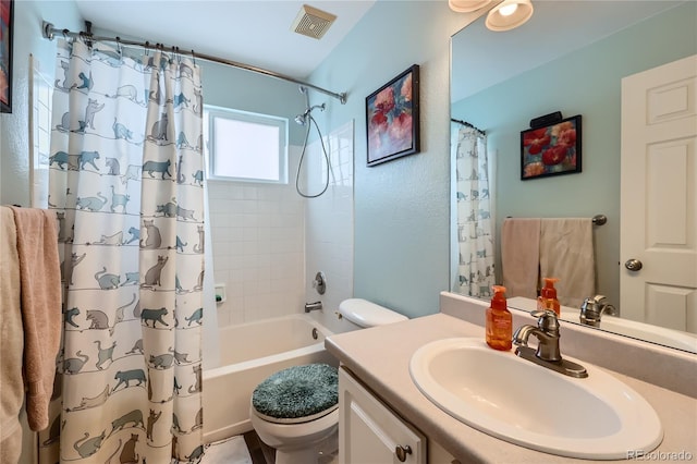 full bathroom with vanity, shower / bath combo, and toilet