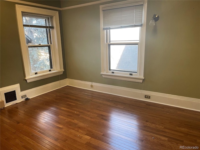 1625 N Downing St, Denver, CO 80218 - empty room featuring plenty of natural light, dark wood-style flooring, and baseboards