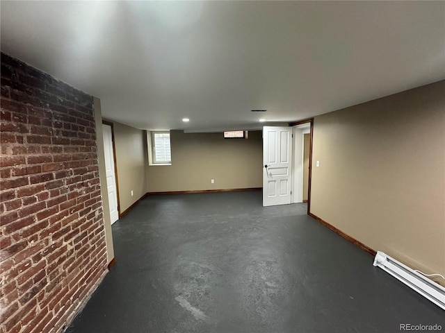 1625 N Downing St, Denver, CO 80218 - basement with a baseboard heating unit, brick wall, baseboards, and recessed lighting