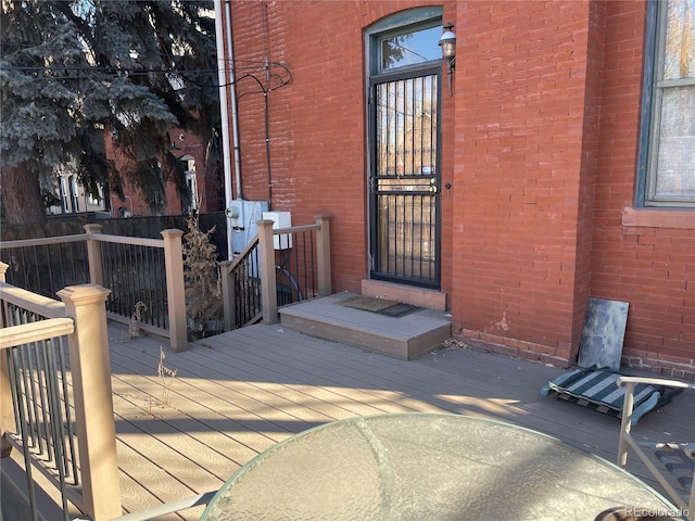 1625 N Downing St, Denver, CO 80218 - entrance to property with a wooden deck and brick siding