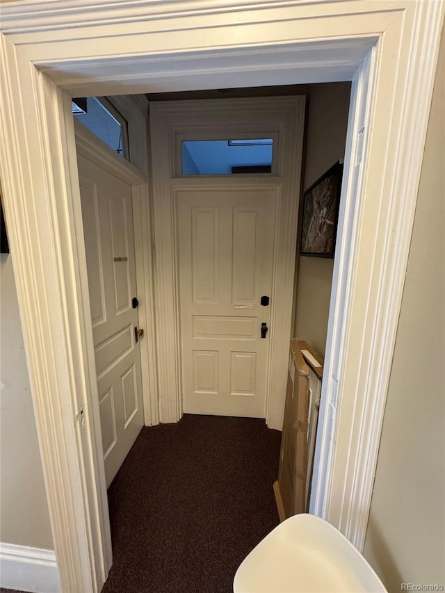 1625 N Downing St, Denver, CO 80218 - hallway featuring dark colored carpet