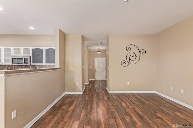8427 S Hoyt Way Unit 107, Littleton, CO 80128 - unfurnished room with wood finished floors and recessed lighting