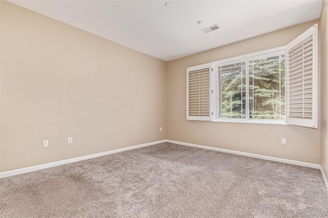 8427 S Hoyt Way Unit 107, Littleton, CO 80128 - carpeted spare room with baseboards