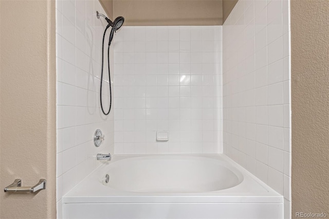 8427 S Hoyt Way Unit 107, Littleton, CO 80128 - full bath with a textured wall and bathtub / shower combination