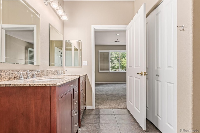 8427 S Hoyt Way Unit 107, Littleton, CO 80128 - bathroom with vanity and tile patterned flooring