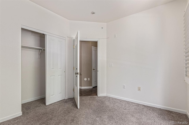 8427 S Hoyt Way Unit 107, Littleton, CO 80128 - unfurnished bedroom featuring carpet floors and a closet