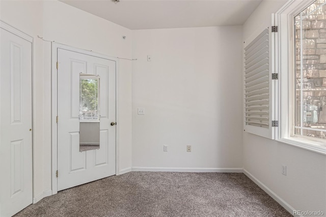 8427 S Hoyt Way Unit 107, Littleton, CO 80128 - carpeted spare room with baseboards