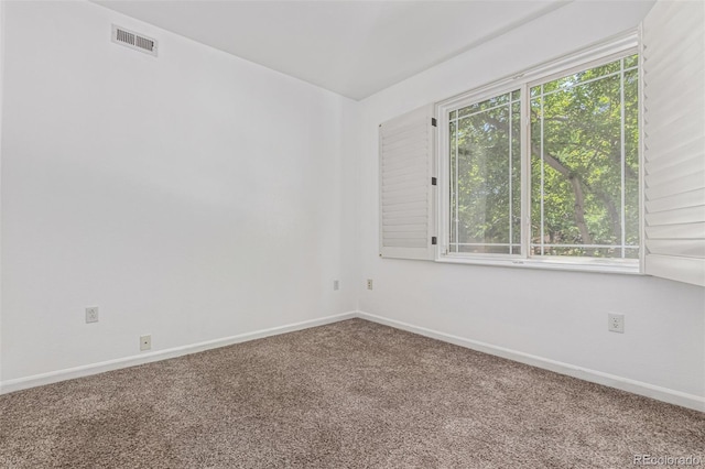 8427 S Hoyt Way Unit 107, Littleton, CO 80128 - carpeted spare room with baseboards