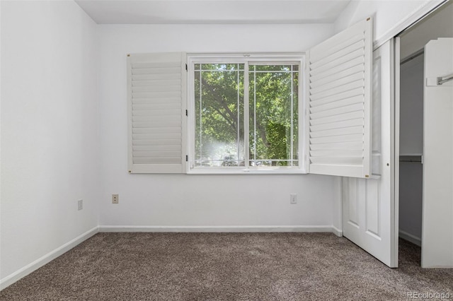 8427 S Hoyt Way Unit 107, Littleton, CO 80128 - unfurnished bedroom with carpet flooring and a closet
