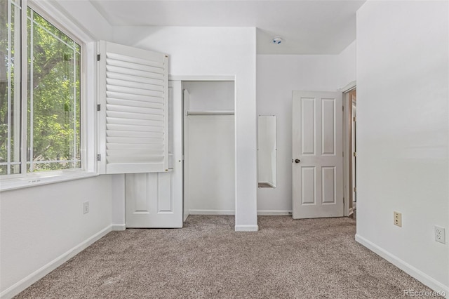 8427 S Hoyt Way Unit 107, Littleton, CO 80128 - unfurnished bedroom featuring carpet and a closet